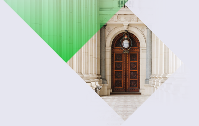 Photo of stately wooden doors at a government building.