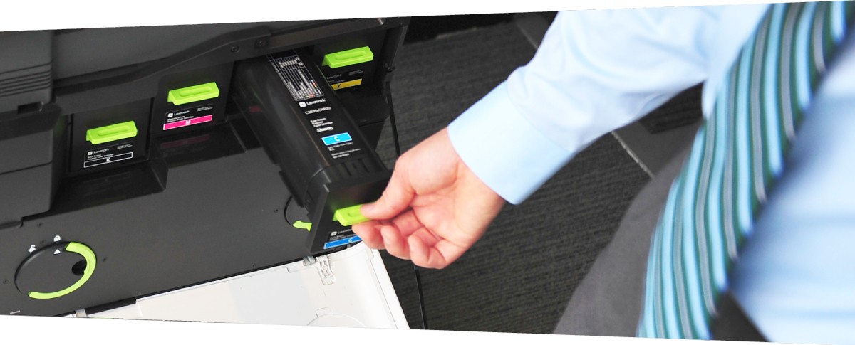 Toner cartridges being put into a printer