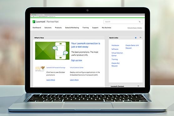 Laptop computer open with the PartnerNet Portal landing page pulled up on screen.
